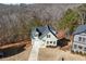 Aerial shot of a light-green two-story home with a driveway and ample yard space at 3185 Tackett Rd, Douglasville, GA 30135