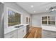 Bright kitchen with stainless steel appliances, double sinks, a view to the backyard and hardwood floors at 3185 Tackett Rd, Douglasville, GA 30135