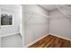 A view into the walk-in closet and dressing area with hardwood floors and natural light at 3185 Tackett Rd, Douglasville, GA 30135