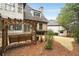 Backyard with a charming wooden swing and string lights, perfect for relaxing outdoors at 415 Prestwick Ct, Alpharetta, GA 30005