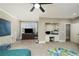 Bright bedroom with a built in desk, a ceiling fan, and neutral walls with white trim at 415 Prestwick Ct, Alpharetta, GA 30005