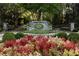 Ardsley Park entrance with stone signage, lush flowerbeds, and wrought iron gates at 415 Prestwick Ct, Alpharetta, GA 30005