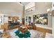 Open living room featuring a vaulted ceiling, fireplace and connection to the kitchen at 415 Prestwick Ct, Alpharetta, GA 30005