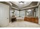 Bright main bathroom featuring a soaking tub, custom cabinets, a makeup vanity, and large windows at 415 Prestwick Ct, Alpharetta, GA 30005