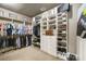 Organized walk-in closet with custom shelving, providing ample storage for clothes, shoes, and accessories at 415 Prestwick Ct, Alpharetta, GA 30005