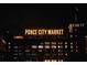 Night view of the iconic Ponce City Market sign lighting up the historic building at 567 Ponce De Leon Ne Ave # 503, Atlanta, GA 30308