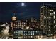 Stunning night view of a building with illuminated windows, showcasing its urban setting and architectural details at 567 Ponce De Leon Ne Ave # 503, Atlanta, GA 30308