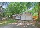 A cozy single story home with stone facade, light beige siding, and a two car garage at 971 Clover Ln, Lawrenceville, GA 30044