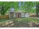 Charming single-story home featuring a stone facade, bright red front door, and a well-maintained lawn at 971 Clover Ln, Lawrenceville, GA 30044