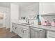 Kitchen featuring white cabinets, granite countertops, stainless steel appliances, and a subway tile backsplash at 971 Clover Ln, Lawrenceville, GA 30044