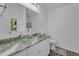 Bright bathroom with granite countertop, dual glass vessel sinks, and elegant finishes at 1020 Adie Cv, Mcdonough, GA 30253