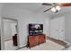 Neutral bedroom featuring carpet, ceiling fan and closet at 1020 Adie Cv, Mcdonough, GA 30253