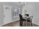 Well-lit dining area with hardwood floors and view of the outdoors, perfect for Gathering meals at 1020 Adie Cv, Mcdonough, GA 30253