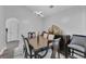 Elegant dining room featuring modern light fixture and beautiful wood table with seating for six at 1020 Adie Cv, Mcdonough, GA 30253