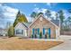Attractive single-story home featuring a stone facade, well-kept lawn, and a two car garage at 1020 Adie Cv, Mcdonough, GA 30253