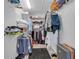 Spacious walk-in closet with organized shelving, hanging racks, and ample storage for clothing at 1020 Adie Cv, Mcdonough, GA 30253