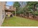 The home features a backyard with a deck above overlooking the yard and surrounding trees at 1312 Preserve Park Dr, Loganville, GA 30052