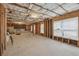 Unfinished basement with exposed insulation and framed walls at 1312 Preserve Park Dr, Loganville, GA 30052