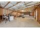 Unfinished basement with exposed insulation, unfinished concrete floors, and wood framing at 1312 Preserve Park Dr, Loganville, GA 30052