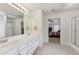 Bathroom with walk-in shower, double vanity sink, and view of the main bedroom at 1312 Preserve Park Dr, Loganville, GA 30052