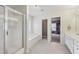 Bathroom with shower, bath tub, double vanity sink, and access to the walk-in closet at 1312 Preserve Park Dr, Loganville, GA 30052