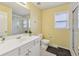 Bathroom featuring a shower-tub combination, white vanity, and window for natural light at 1312 Preserve Park Dr, Loganville, GA 30052