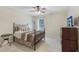 Well-lit bedroom with a ceiling fan, window, and nice furnishings at 1312 Preserve Park Dr, Loganville, GA 30052