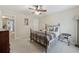 Bright bedroom with a ceiling fan, window, and comfortable bed at 1312 Preserve Park Dr, Loganville, GA 30052