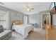Bedroom with a neutral color scheme, a ceiling fan, and plenty of natural light at 1312 Preserve Park Dr, Loganville, GA 30052