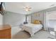 Cozy bedroom with a ceiling fan, a TV, and neutral gray colored walls at 1312 Preserve Park Dr, Loganville, GA 30052