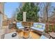 The outdoor deck offers versatile seating options with a dining area and cozy lounge space, perfect for entertaining or relaxing at 1312 Preserve Park Dr, Loganville, GA 30052