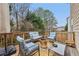 The outdoor deck features comfortable seating arrangements, complete with a modern fire pit for cozy gatherings and relaxation at 1312 Preserve Park Dr, Loganville, GA 30052