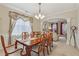 Elegant dining room featuring detailed trim, a large table, and arched entryway at 1312 Preserve Park Dr, Loganville, GA 30052