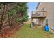 The exterior view showcases the raised deck that overlooks the yard and its trees, perfect for outdoor enjoyment at 1312 Preserve Park Dr, Loganville, GA 30052