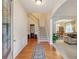 Open foyer with hardwood floors, staircase, and views into the living and dining areas at 1312 Preserve Park Dr, Loganville, GA 30052
