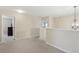 Upstairs hallway featuring a chandelier, neutral walls, and carpet at 1312 Preserve Park Dr, Loganville, GA 30052