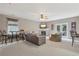 Spacious living room with a cozy fireplace and outdoor access and plenty of natural light at 1312 Preserve Park Dr, Loganville, GA 30052