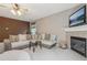 Relaxing living room featuring a fireplace, comfortable seating, and natural light at 1312 Preserve Park Dr, Loganville, GA 30052