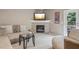 Inviting living room featuring a fireplace, comfortable seating, and access to the outdoors at 1312 Preserve Park Dr, Loganville, GA 30052