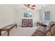 Bright living room with ceiling fan, television, books, and comfortable seating at 1312 Preserve Park Dr, Loganville, GA 30052