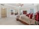 Expansive main bedroom with tray ceiling, sitting area, and large windows at 1312 Preserve Park Dr, Loganville, GA 30052