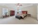 Spacious main bedroom with tray ceiling, multiple windows, and a sitting area at 1312 Preserve Park Dr, Loganville, GA 30052