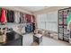 Walk-in closet with organization system, storage, shelving, and shoe boxes at 1312 Preserve Park Dr, Loganville, GA 30052