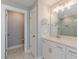 Bathroom features an oversized shower with bench, and white marble countertop at 1703 Prospect Way, Conyers, GA 30094