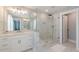 Modern bathroom with a seamless glass shower, white marble accents, and double vanity at 1703 Prospect Way, Conyers, GA 30094