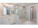 Bathroom features an extra-large shower with bench, lots of light, and double vanity at 1703 Prospect Way, Conyers, GA 30094