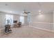 Versatile bonus room with neutral carpet, exercise equipment, and a dedicated office space at 1703 Prospect Way, Conyers, GA 30094