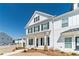 Charming two-story home features white siding, black shutters and tasteful landscaping at 1703 Prospect Way, Conyers, GA 30094