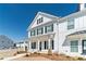 Close-up view of a charming two-story home with black shutters and white siding at 1703 Prospect Way, Conyers, GA 30094