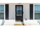 Front Door close up with black shutters and address 1703 above the door frame at 1703 Prospect Way, Conyers, GA 30094